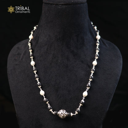 Vintage sterling silver necklace with pearl and karungali beads, featuring intricate tribal design by TRIBAL ORNAMENTS.