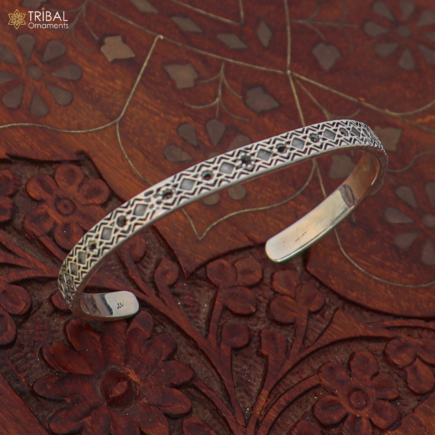 Stylish unisex 925 sterling silver adjustable bangle bracelet with intricate tribal-inspired design and cuff style.