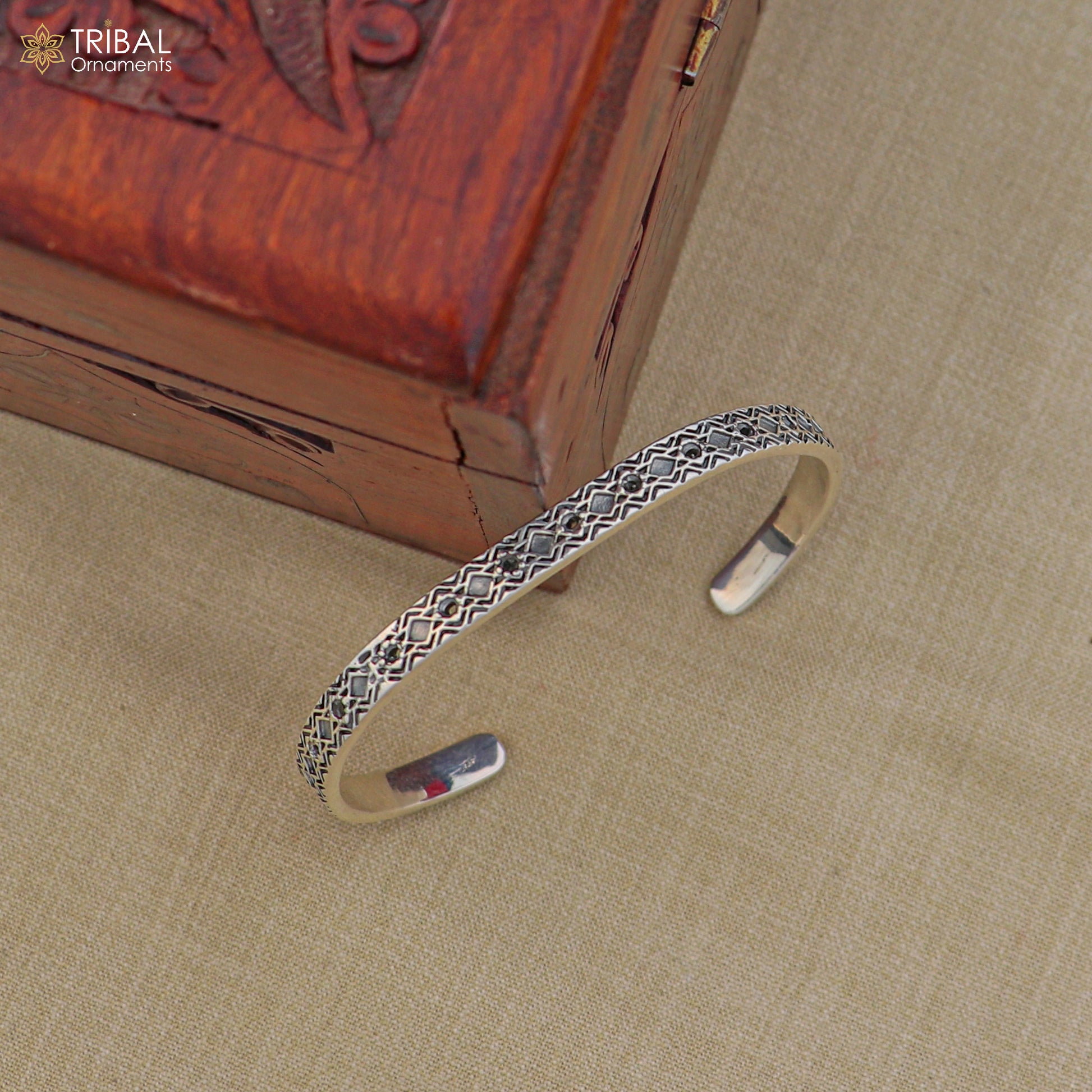 Stylish 925 sterling silver adjustable bangle bracelet by TRIBAL ORNAMENTS, unisex jewelry cuff with intricate design.