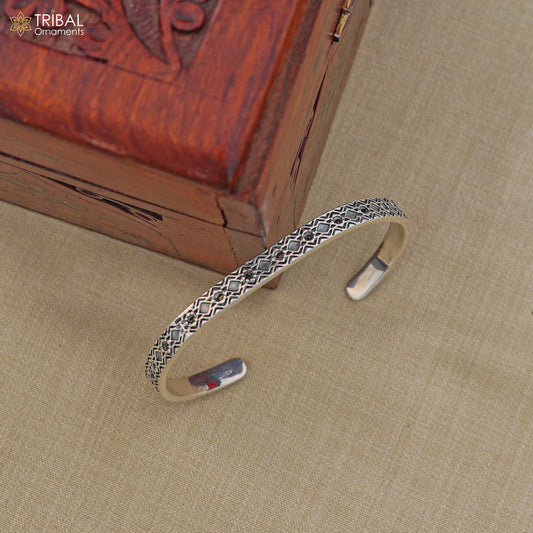 Stylish 925 sterling silver adjustable bangle bracelet by TRIBAL ORNAMENTS, unisex jewelry cuff with intricate design.