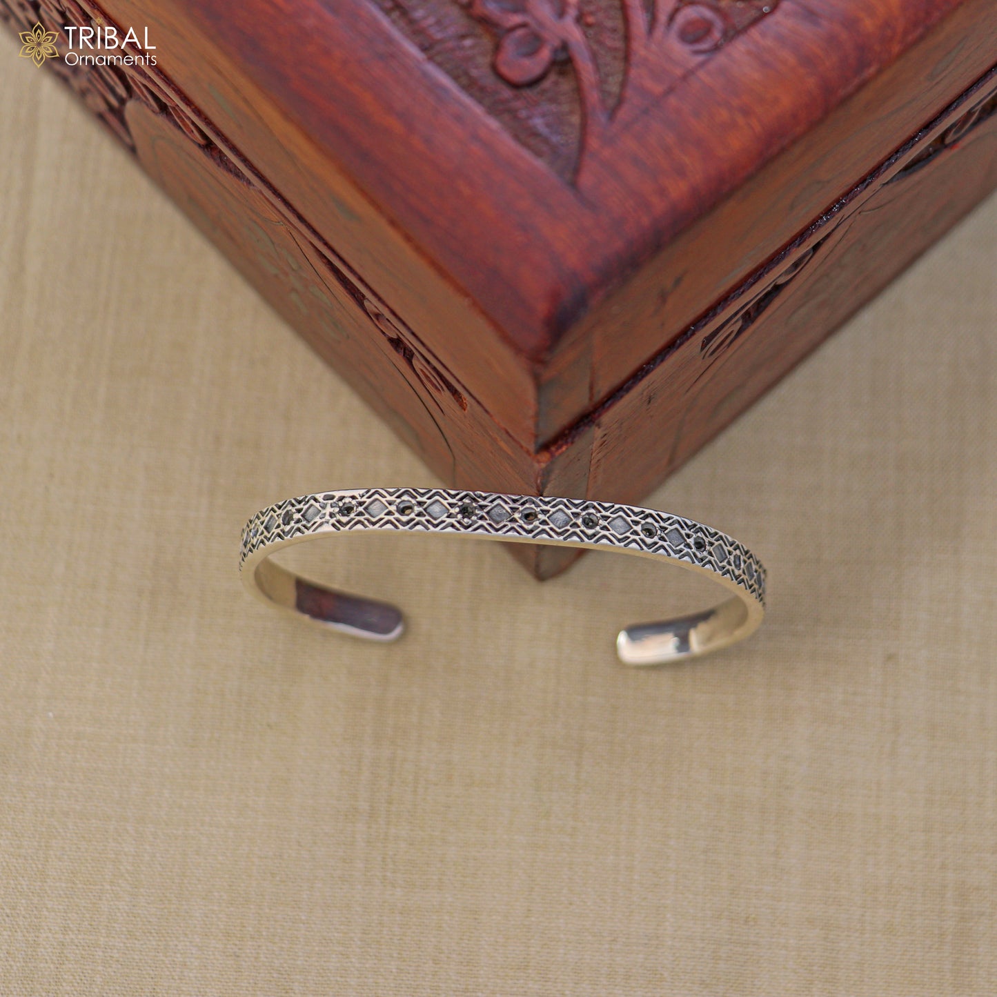 Sterling silver adjustable bangle bracelet by TRIBAL ORNAMENTS, stylish unisex jewelry cuff with intricate design.