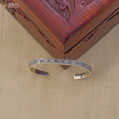Sterling silver adjustable bangle cuff bracelet by TRIBAL ORNAMENTS, unisex stylish jewelry with intricate design and smooth finish.