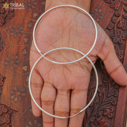 Elegant 925 sterling silver round hoops earrings by TRIBAL ORNAMENTS, showcasing smooth polished surface and classic design.