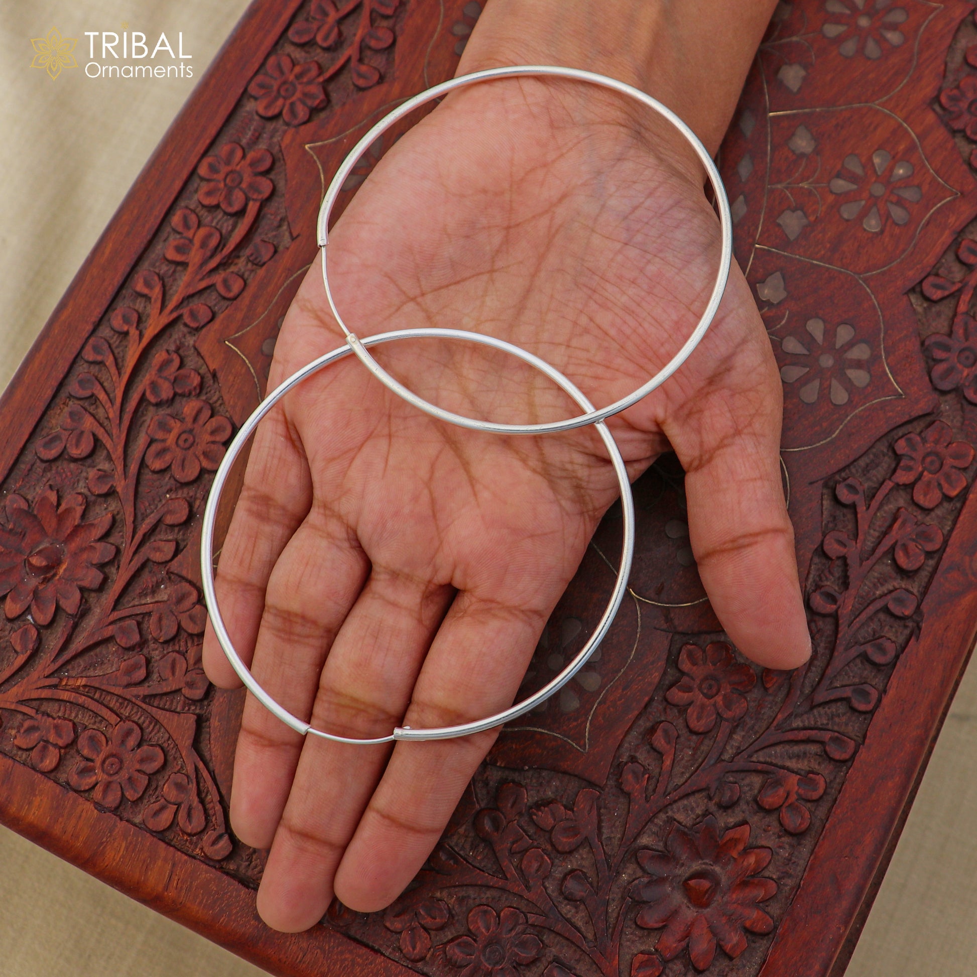 Sterling silver round hoops earrings with an elegant design, perfect for jewelry enthusiasts by TRIBAL ORNAMENTS.