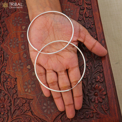 Elegant 925 sterling silver round hoops earrings by TRIBAL ORNAMENTS, featuring a smooth, polished finish and classic hoop design.