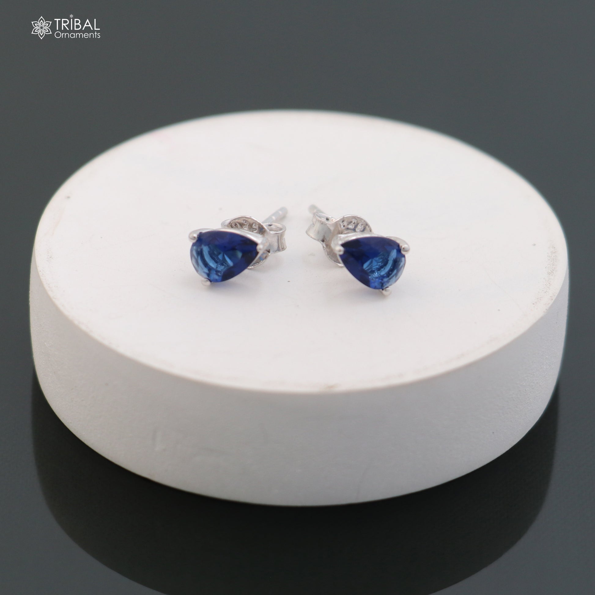 925 sterling silver oval-shaped stone stud earring by TRIBAL ORNAMENTS, showcasing a polished gemstone in a sleek, unisex jewelry design.