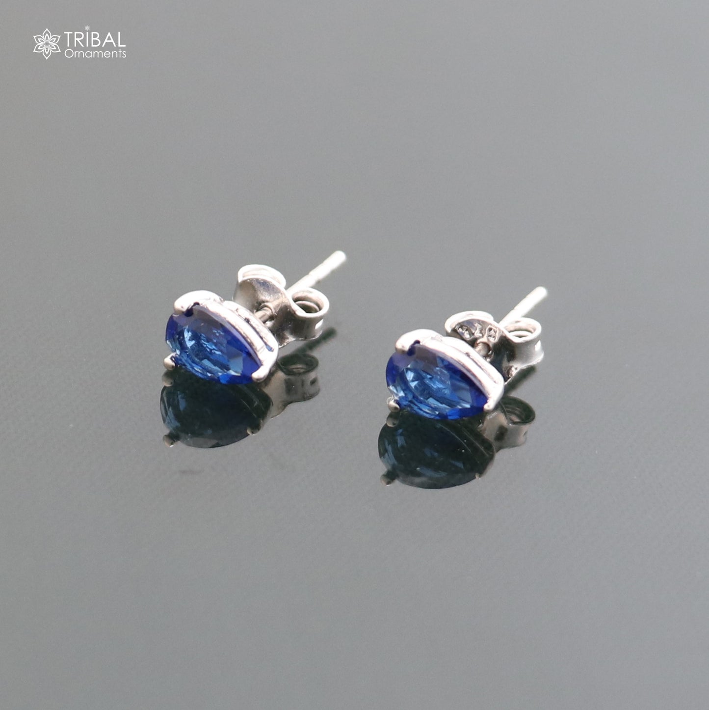 925 sterling silver oval-shaped stone stud earring from TRIBAL ORNAMENTS, showcasing a polished metal finish and elegant design.
