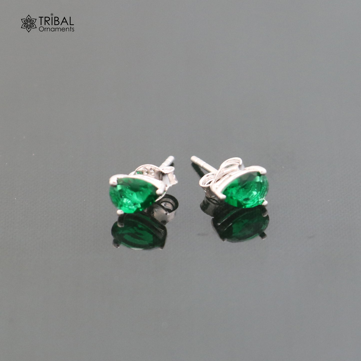 925 sterling silver oval stone stud earring by TRIBAL ORNAMENTS, unisex jewelry with a polished oval gemstone setting.