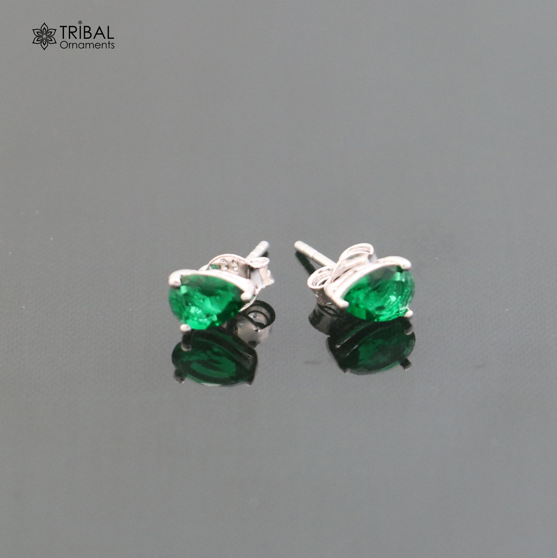 925 sterling silver oval stone stud earring by TRIBAL ORNAMENTS, unisex jewelry with a polished oval gemstone setting.