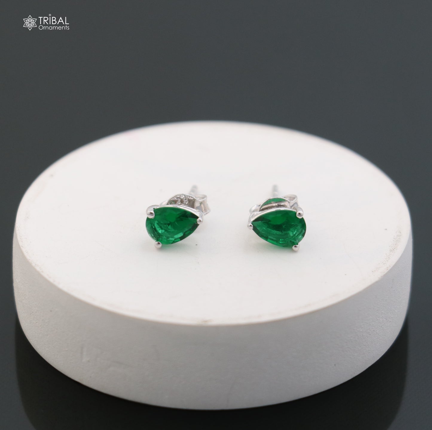 Sterling silver oval stone stud earring by TRIBAL ORNAMENTS, unisex jewelry with a polished oval gemstone and sleek silver setting.
