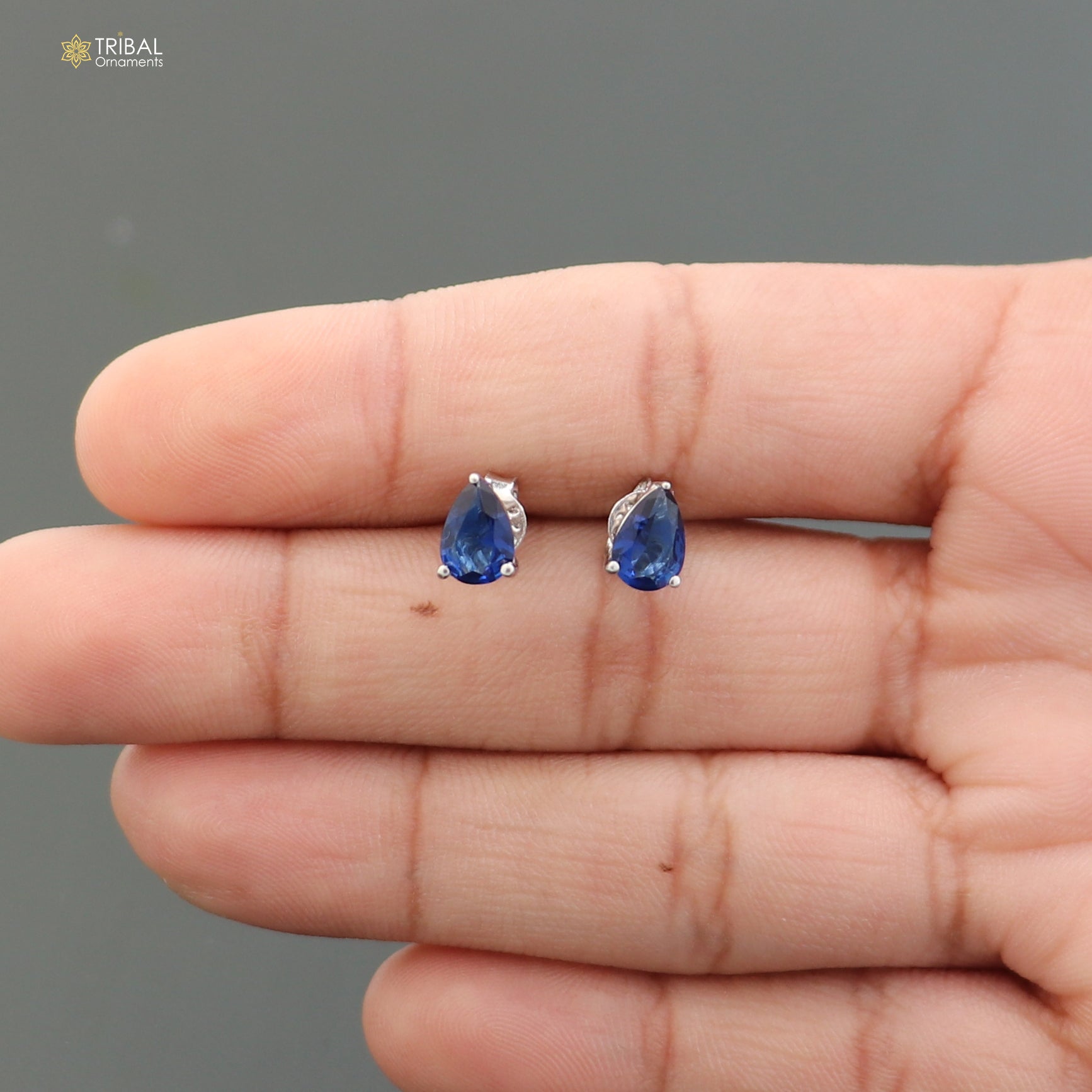 Sterling silver oval-shaped stone stud earring by TRIBAL ORNAMENTS, unisex jewelry with polished silver finish and elegant design.