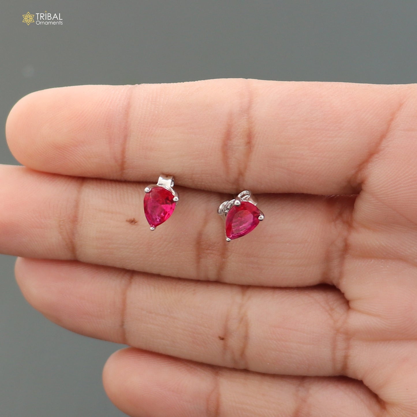 925 sterling silver oval stone stud earring by TRIBAL ORNAMENTS, unisex jewelry with a polished oval gemstone design.