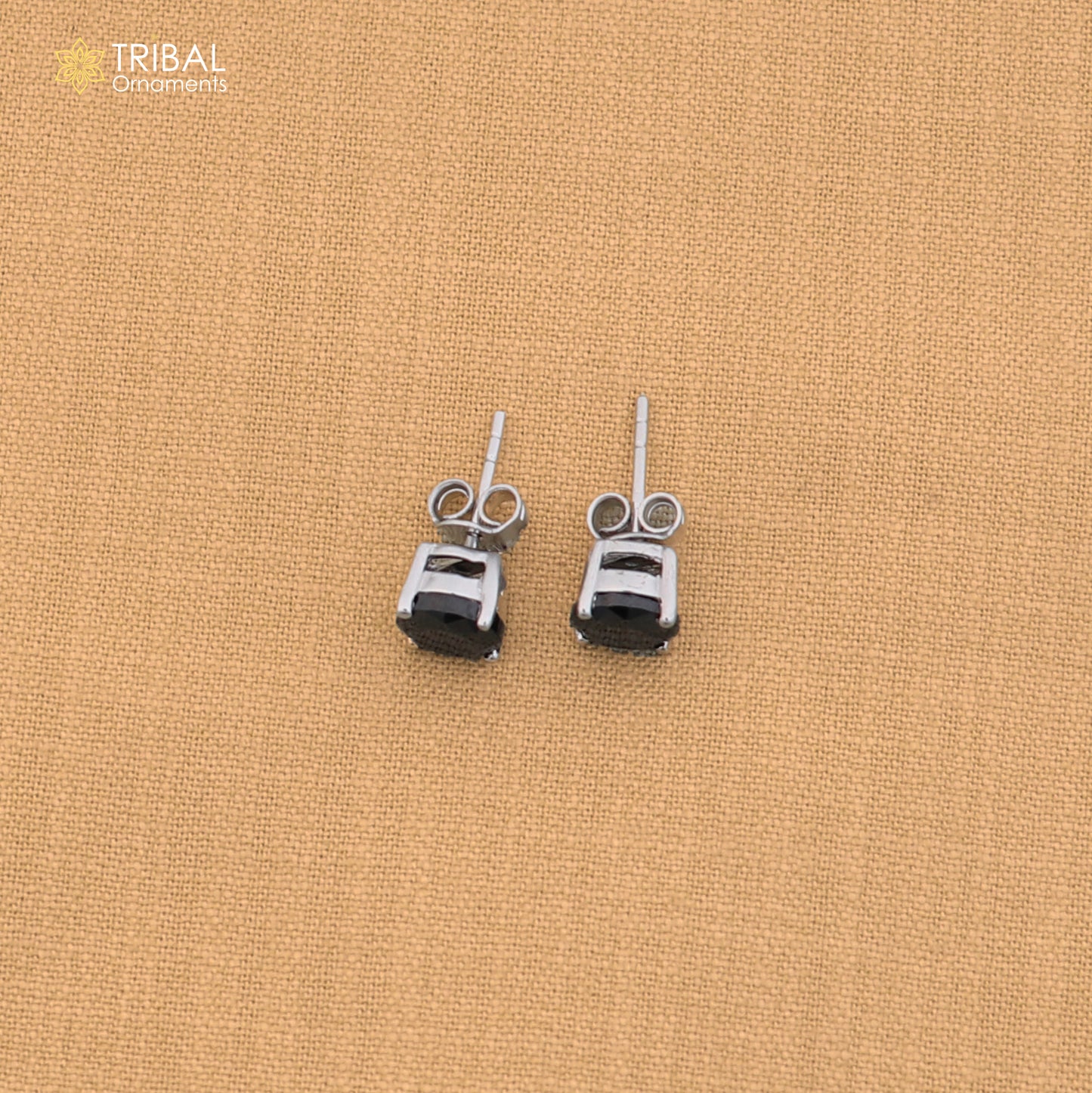 925 sterling silver round black stone stud earring, unisex jewelry by TRIBAL ORNAMENTS, shown with a close-up of the design.