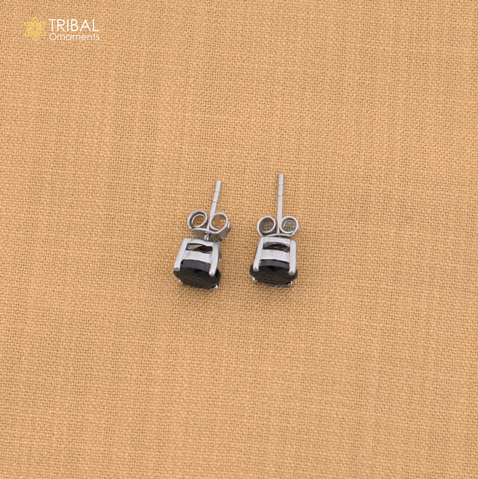 925 sterling silver round black stone stud earring, unisex jewelry by TRIBAL ORNAMENTS, shown with a close-up of the design.
