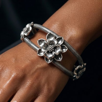 Sterling silver handmade flower-themed vintage bangle bracelet with detailed floral work, traditional wedding jewelry by Tribal Ornaments.