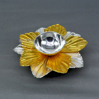 Pure silver flower design oil lamp by TRIBAL ORNAMENTS, decorative deepak for home temple, detailed floral craftsmanship.