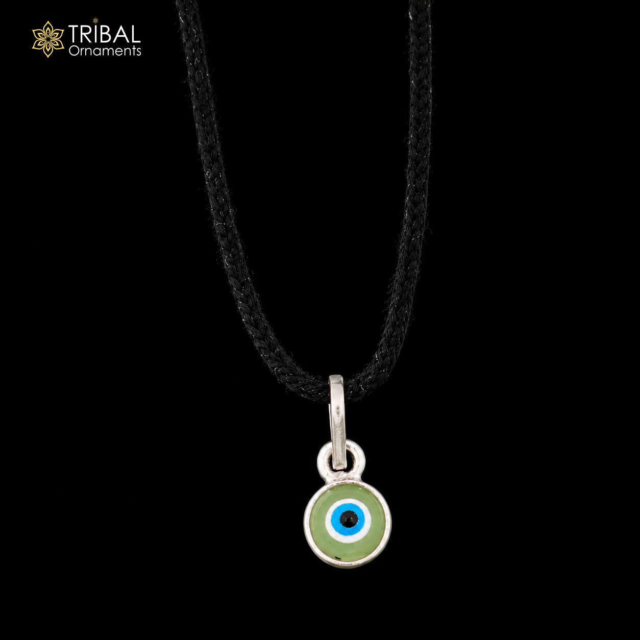 Sterling silver evil eye pendant for girls and kids, protective jewelry by TRIBAL ORNAMENTS, featuring a detailed evil eye design.