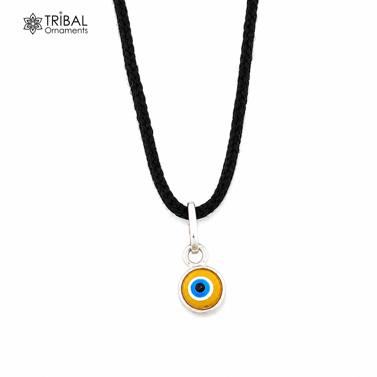 Sterling silver evil eye pendant for girls and kids, protective jewelry, crafted by TRIBAL ORNAMENTS, with detailed blue and silver design.