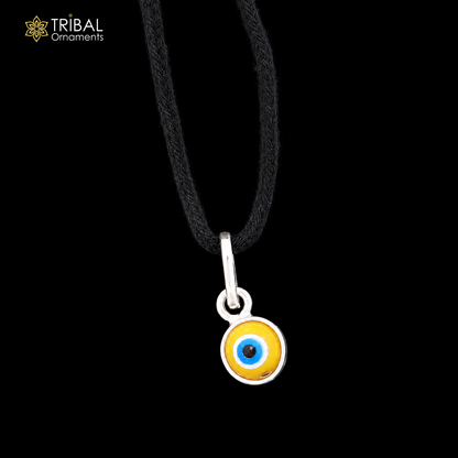 Sterling silver evil eye pendant for girls, children's protective jewelry by TRIBAL ORNAMENTS, featuring a detailed evil eye design.