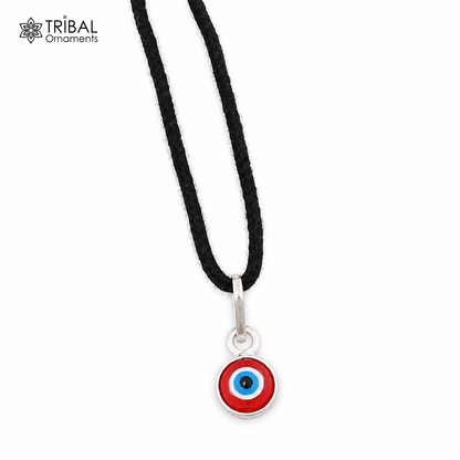 Sterling silver evil eye pendant for girls and kids, protective jewelry by TRIBAL ORNAMENTS, featuring a blue eye design.
