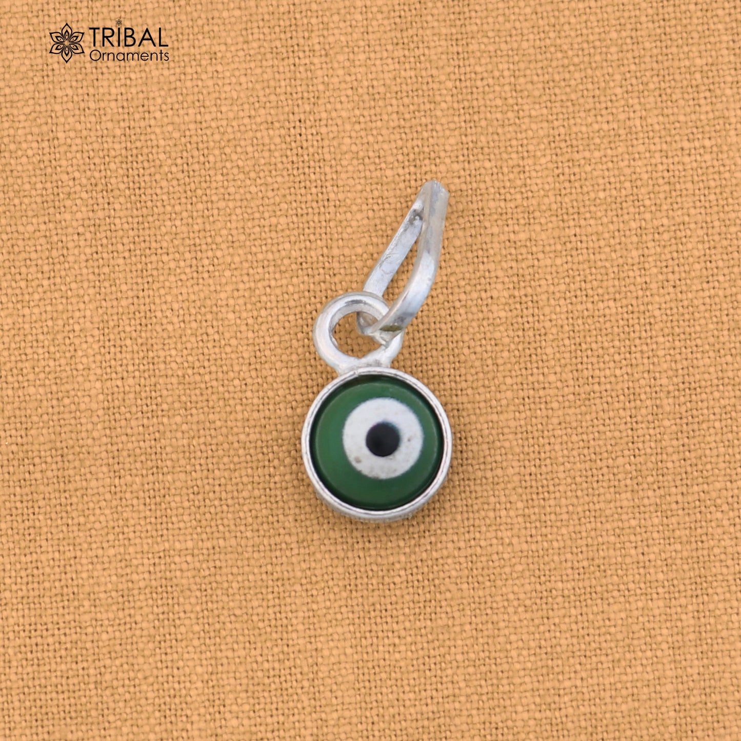 Sterling silver evil eye pendant for girls and kids, protective jewelry by TRIBAL ORNAMENTS, shown on a white background.