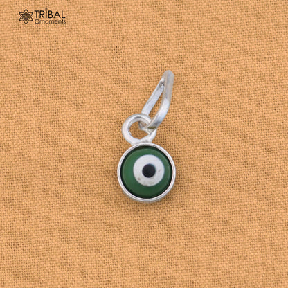Sterling silver evil eye pendant for girls and kids, protective jewelry by TRIBAL ORNAMENTS, shown on a white background.