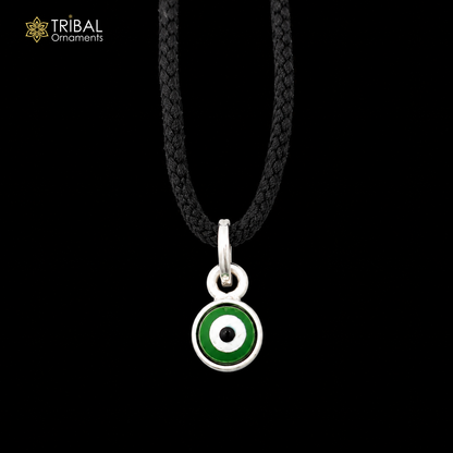Sterling silver evil eye pendant for girls and kids, protective jewelry by TRIBAL ORNAMENTS, featuring a blue and white evil eye design.