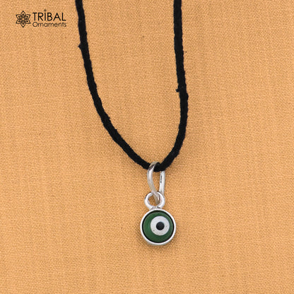 Sterling silver evil eye pendant for girls and kids, protective jewelry by TRIBAL ORNAMENTS, featuring a blue and silver design.