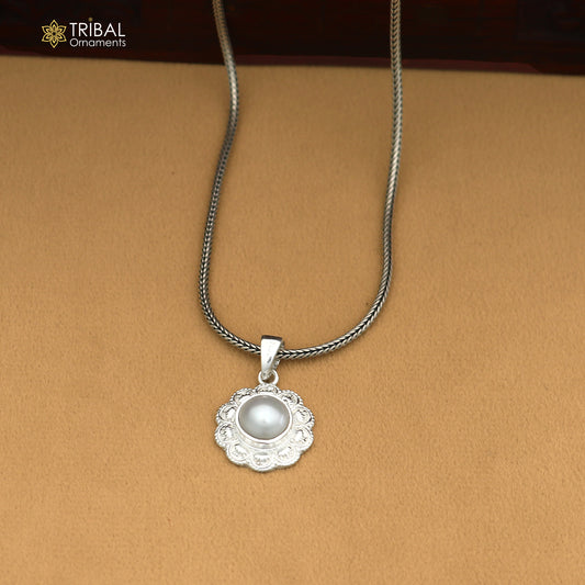 Sterling silver round floral style pendant with pearl, unisex jewelry by TRIBAL ORNAMENTS, featuring intricate floral design and a pearl accent.