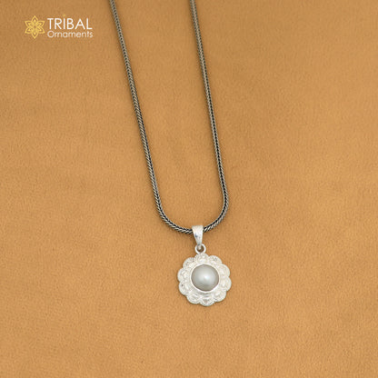 Sterling silver round floral pendant with pearl, unisex jewelry by TRIBAL ORNAMENTS, featuring intricate floral design and hanging pearl.