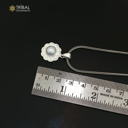 Sterling silver floral round pendant with pearl, unisex jewelry by TRIBAL ORNAMENTS, featuring intricate floral design and smooth pearl accent.