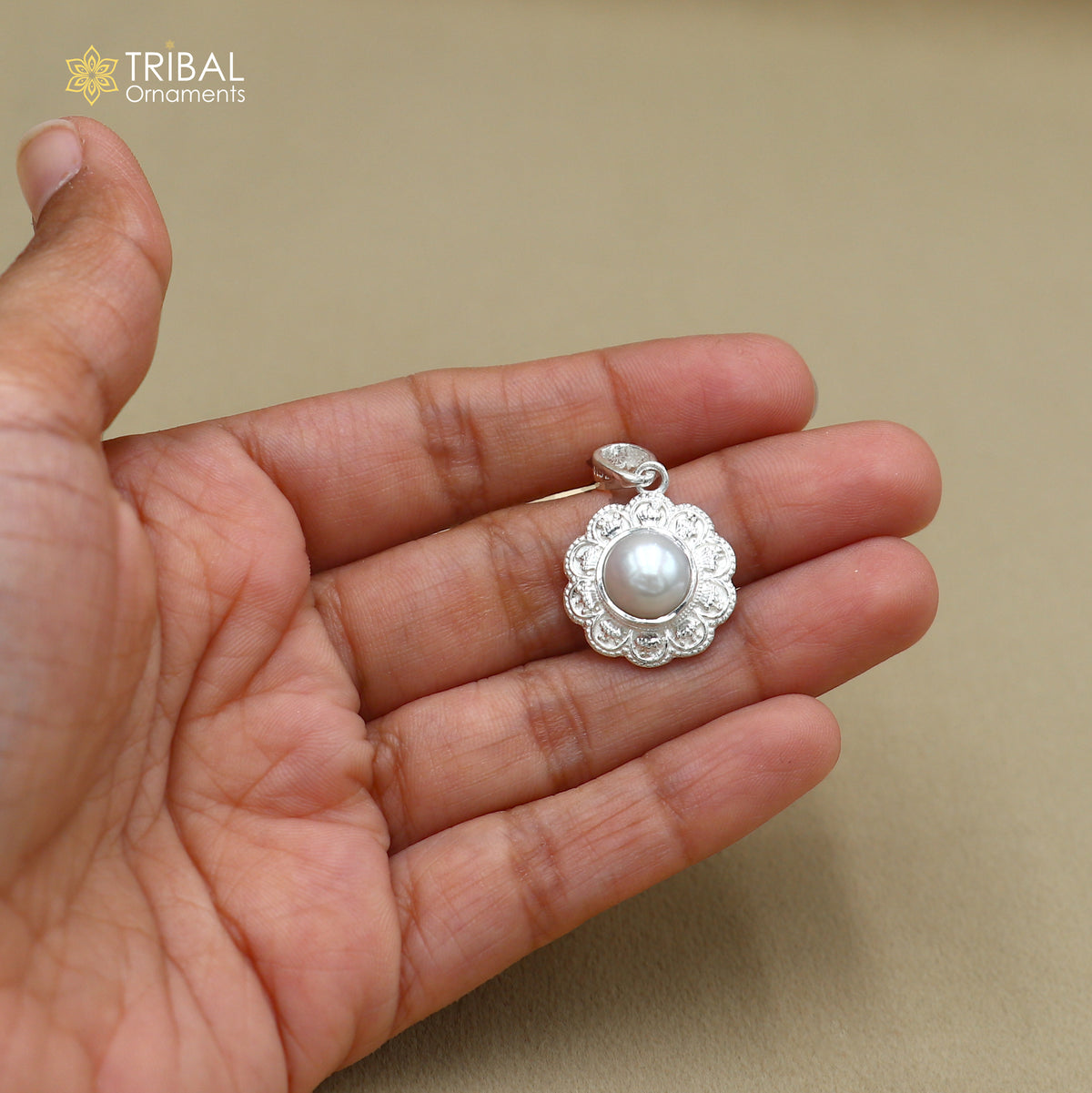 925 Sterling silver floral round pendant with pearl, unisex jewelry by TRIBAL ORNAMENTS, featuring intricate floral design and smooth pearl.