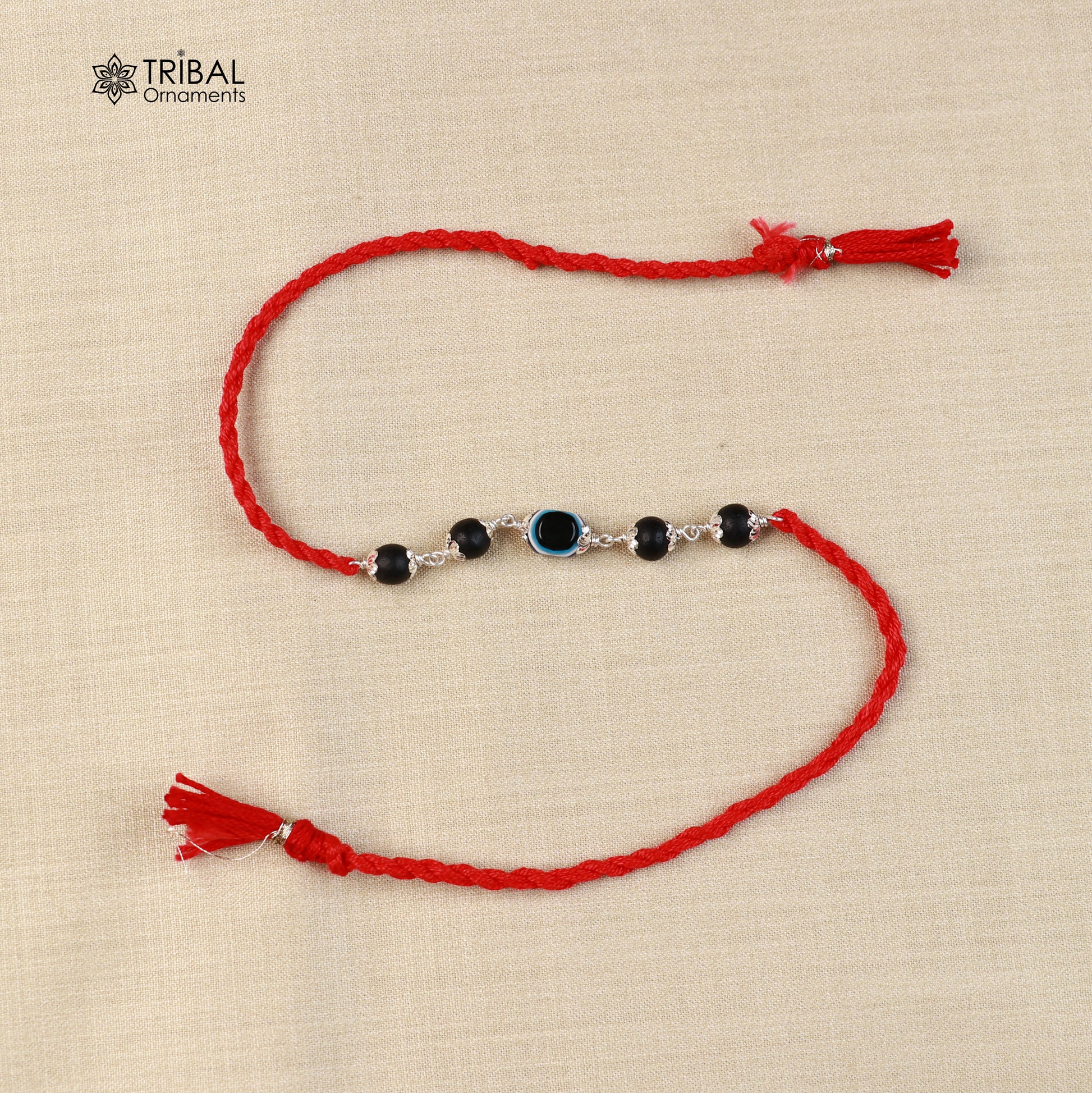925 sterling silver KARUNGALI and evil eye beads red thread rakhi bracelet with intricate design from Tribal Ornaments.