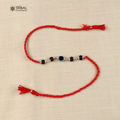 925 sterling silver KARUNGALI and evil eye beads red thread rakhi bracelet with intricate design from Tribal Ornaments.