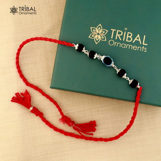 925 silver KARUNGALI and evil eye beads red thread rakhi bracelet with tribal design, handcrafted by TRIBAL ORNAMENTS.