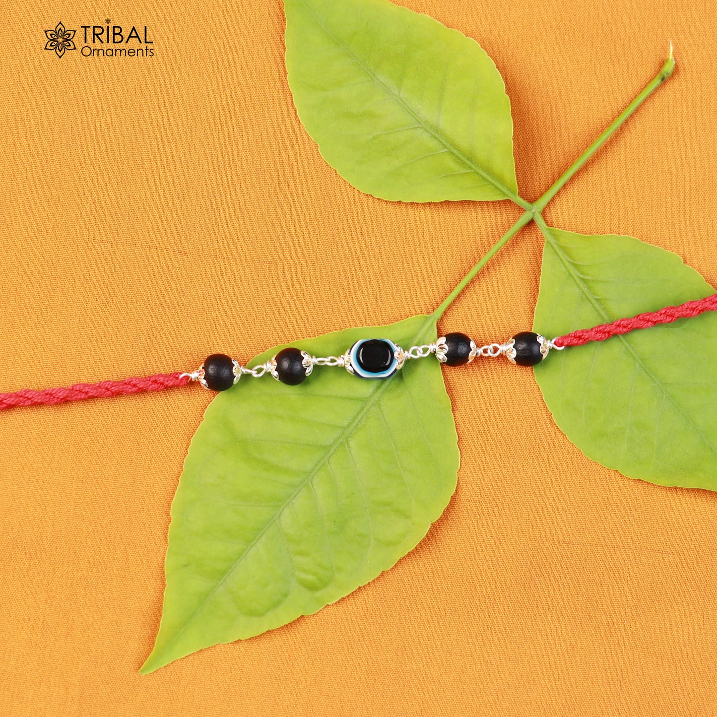 925 sterling silver KARUNGALI and evil eye beads red thread rakhi bracelet with intricate design by TRIBAL ORNAMENTS