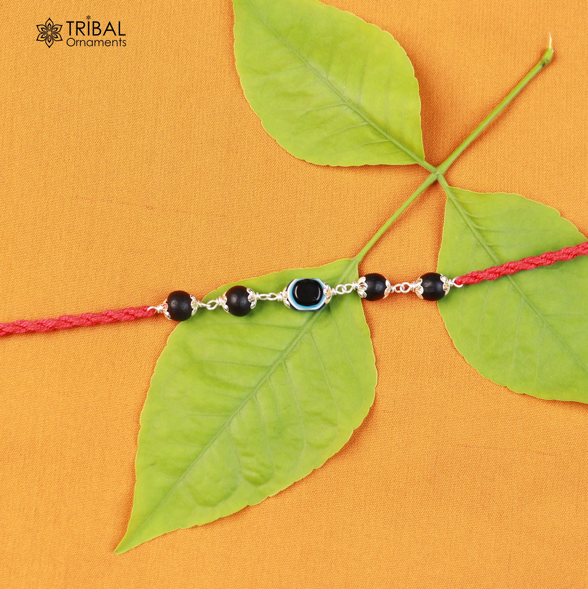925 sterling silver KARUNGALI and evil eye beads red thread rakhi bracelet with intricate design by TRIBAL ORNAMENTS
