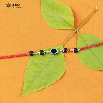 925 sterling silver KARUNGALI and evil eye beads red thread rakhi bracelet with intricate design by TRIBAL ORNAMENTS