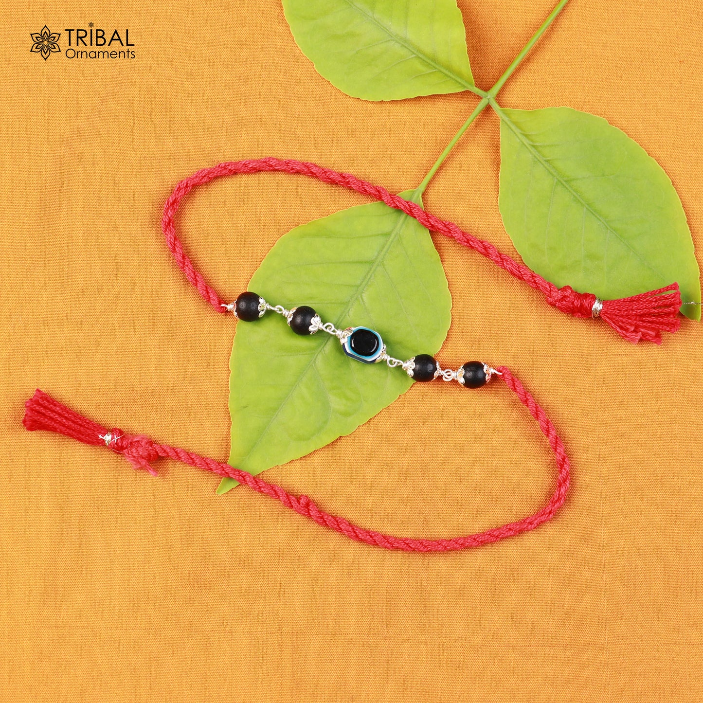 Sterling silver KARUNGALI and evil eye beads red thread rakhi bracelet with intricate tribal design and traditional craftsmanship.