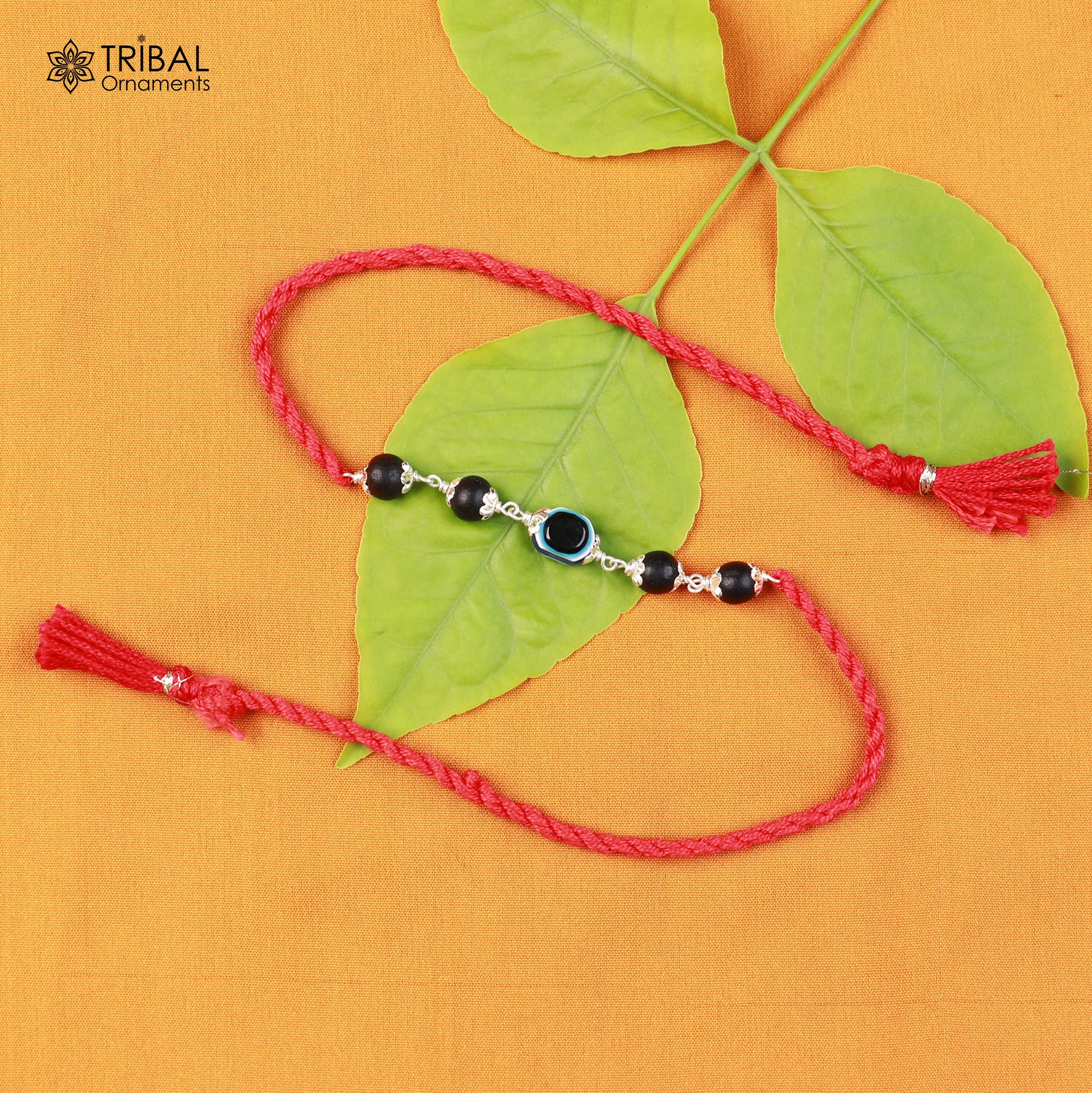 Sterling silver KARUNGALI and evil eye beads red thread rakhi bracelet with intricate tribal design and traditional craftsmanship.
