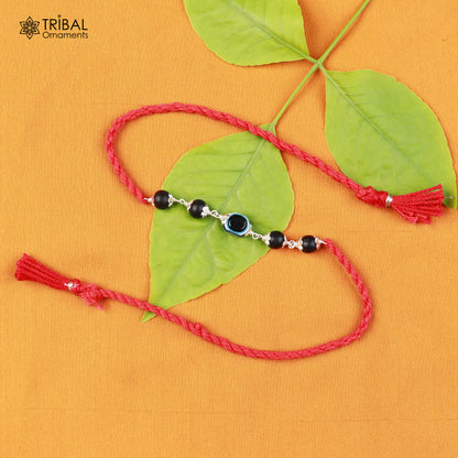 Sterling silver KARUNGALI and evil eye beads red thread rakhi bracelet with intricate tribal design and traditional craftsmanship.