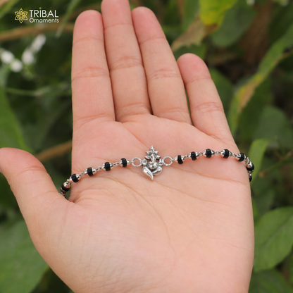 Sterling silver Lord Ganesha bracelet with Rudraksha and Tulsi beads, handcrafted by TRIBAL ORNAMENTS.