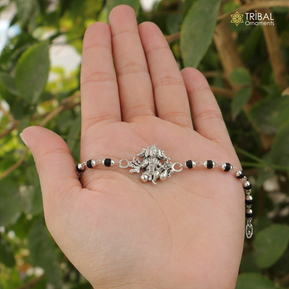 Sterling silver Lord Panchmukhi Hanuman bracelet with Rudraksha, tulsi beads, and silver beads for Rakhi celebrations.