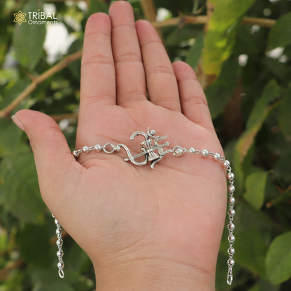 Sterling silver Om Rudraksha and Tulsi beads bracelet with black and white accents, handcrafted tribal jewelry for spiritual adornment.
