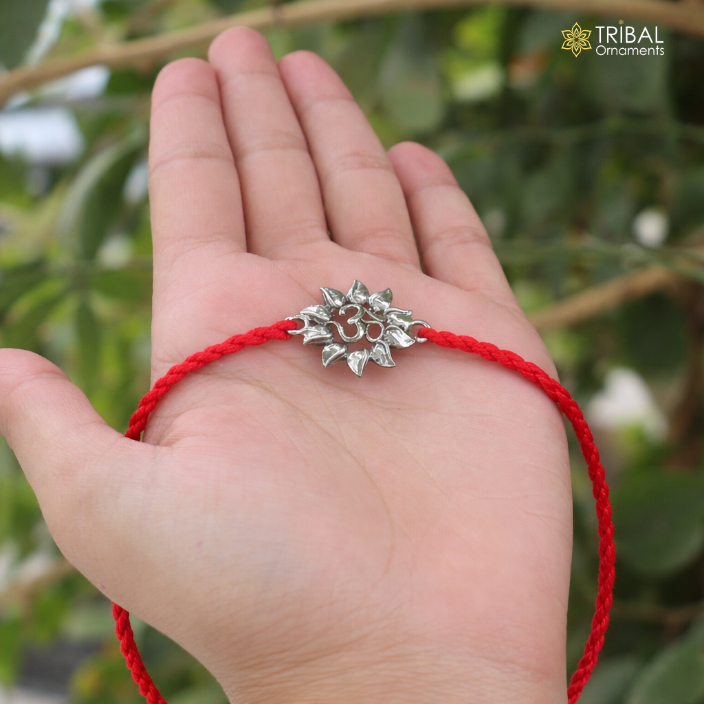 925 Sterling silver Om design thread rakhi bracelet with intricate detailing, crafted by TRIBAL ORNAMENTS.