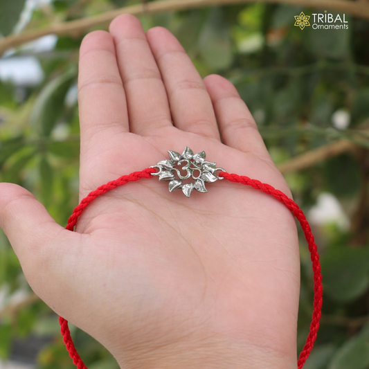 925 Sterling silver Om design thread rakhi bracelet with intricate detailing, crafted by TRIBAL ORNAMENTS.