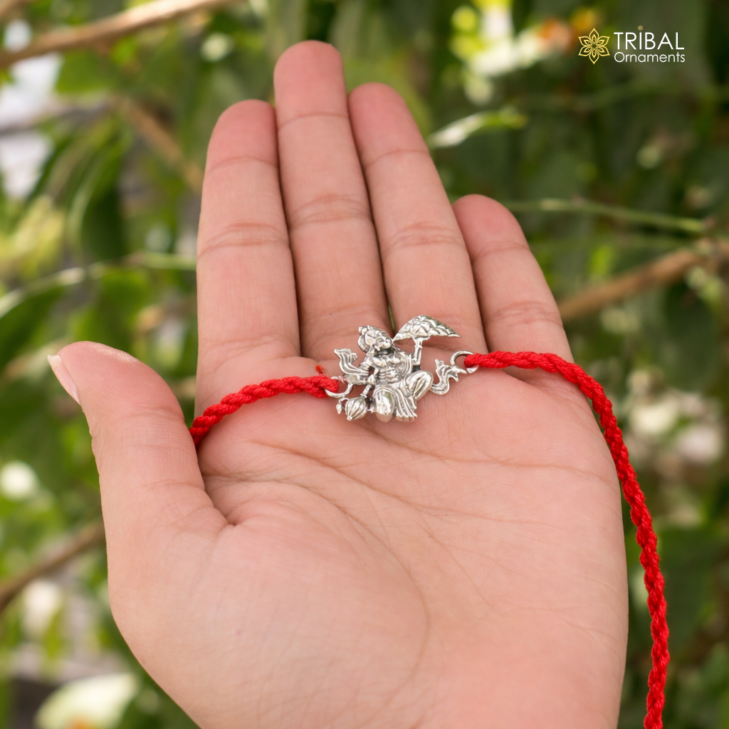 Sterling silver Lord Hanuman thread rakhi bracelet with intricate design, crafted by TRIBAL ORNAMENTS, perfect for festive celebrations.