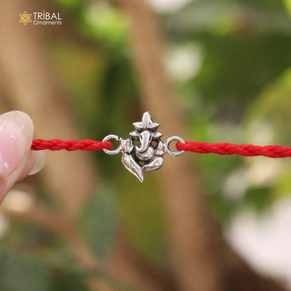 Sterling silver Lord Ganesha thread rakhi bracelet with intricate design by TRIBAL ORNAMENTS, ideal for traditional celebrations