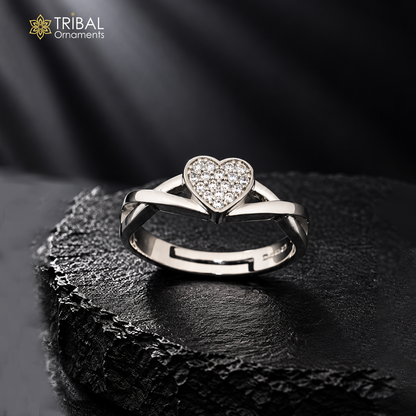 Sterling silver heart design ring with cubic zirconia stones by TRIBAL ORNAMENTS, featuring a detailed heart motif and polished silver band