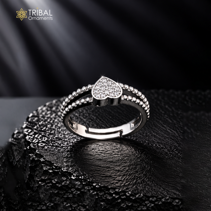 Sterling silver heart design CZ stone ring by TRIBAL ORNAMENTS featuring a polished band and sparkling gemstone accents.